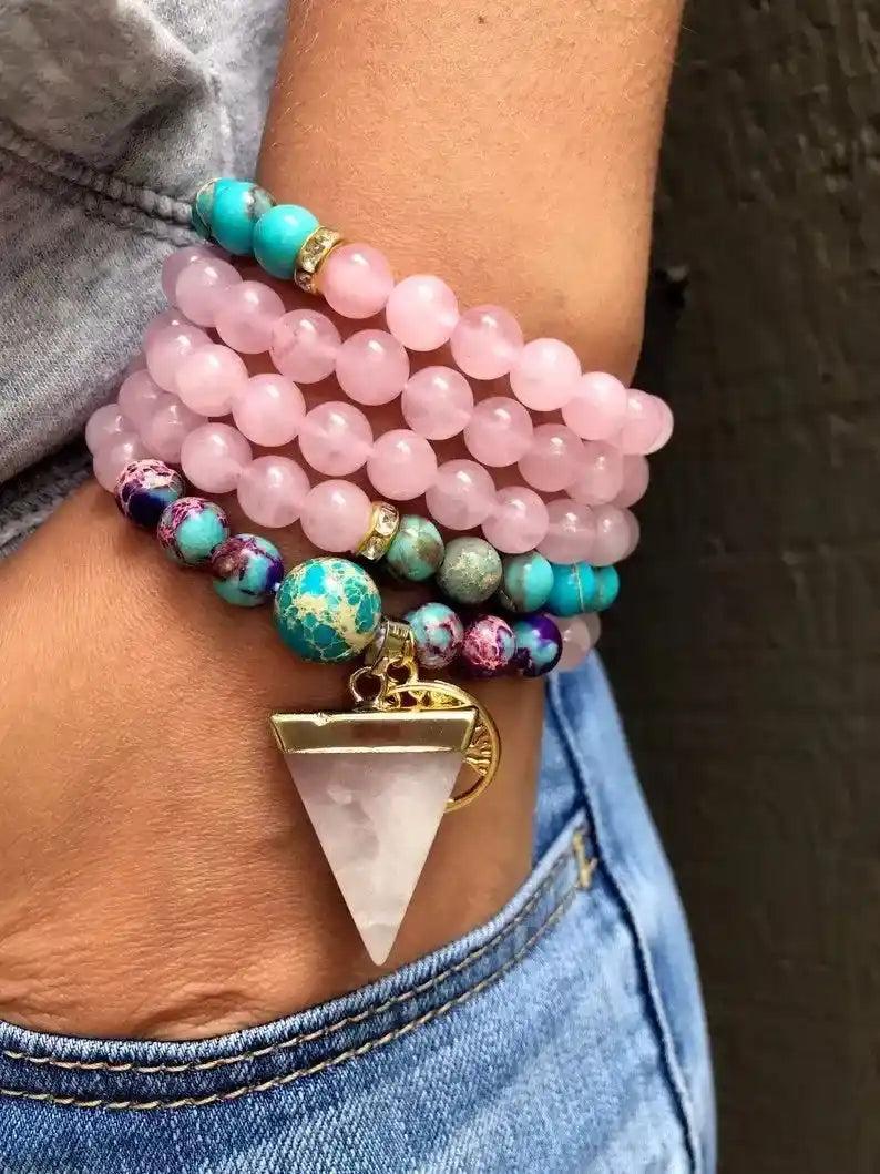 Rose Quartz & Imperial Jasper 108 Bead Mala Bracelet with pink, blue, and purple beads, and a triangular pendant.