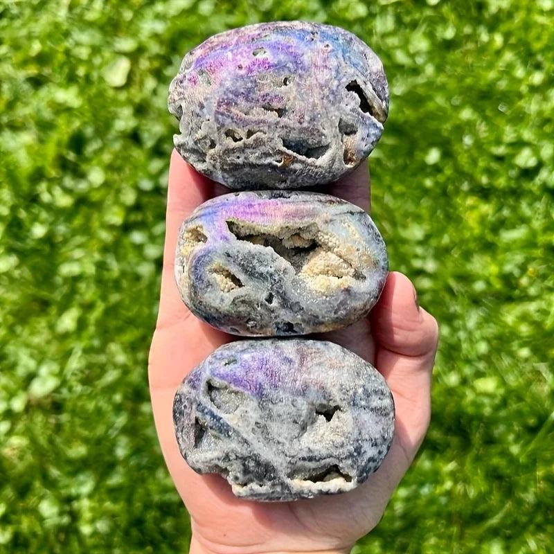 Sparkling Druzy Sphalerite Titanium Bubble Palm Stones with vibrant purple sheen and natural crystal cavities.