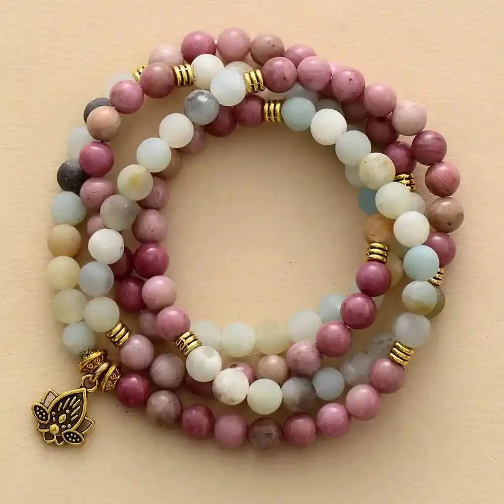 Crystal Destiny's 108-bead Agate Lotus Mala Necklace with pink, white, and blue beads, gold accents, and a lotus charm.