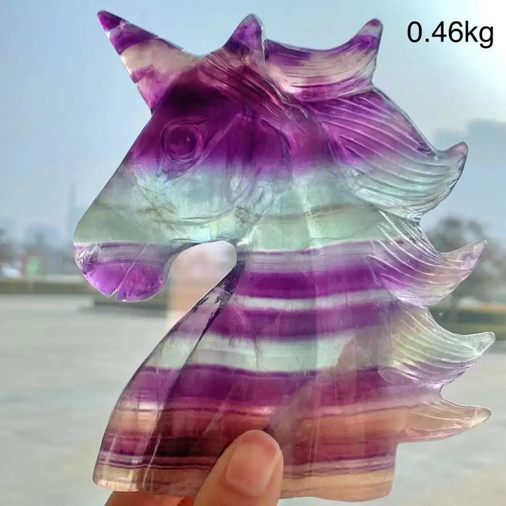 Vibrant rainbow fluorite unicorn carving, 12CM, showcasing purple, green, and white bands. Natural stone crystal decor.