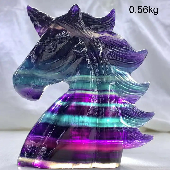 Vibrant rainbow fluorite unicorn carving, 12CM, showcasing stunning purple and teal bands for aesthetic decor.