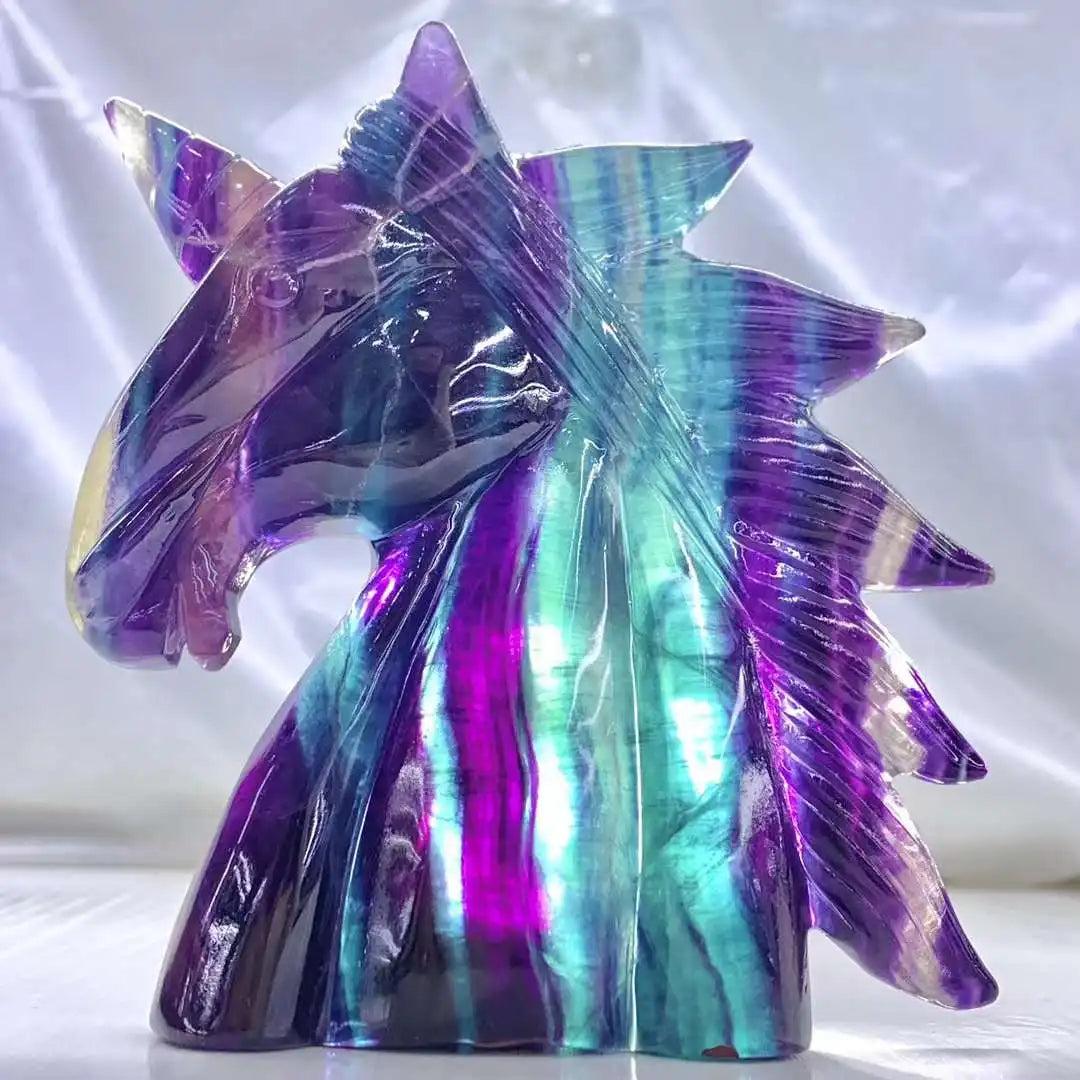 Vibrant 12CM Rainbow Fluorite Unicorn Carving. Natural stone crystal figurine with purple, blue, and green hues.