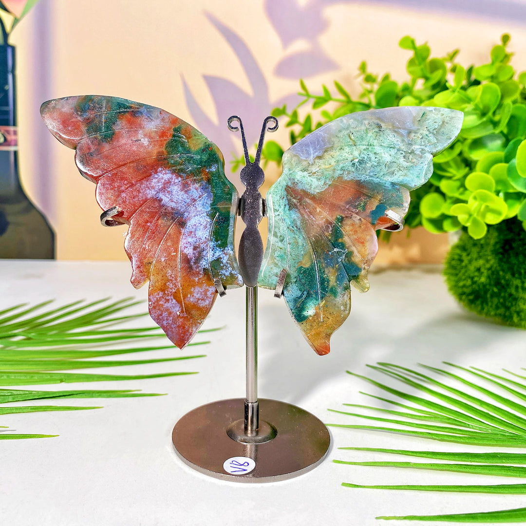 High-quality crystal butterfly wing with stand, featuring vibrant red, green, and blue natural crystal for healing and decor.