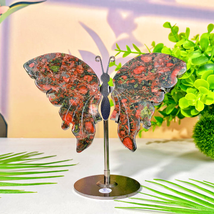 High-quality crystal butterfly wing with stand, featuring vibrant red and green natural crystal for healing and decoration.