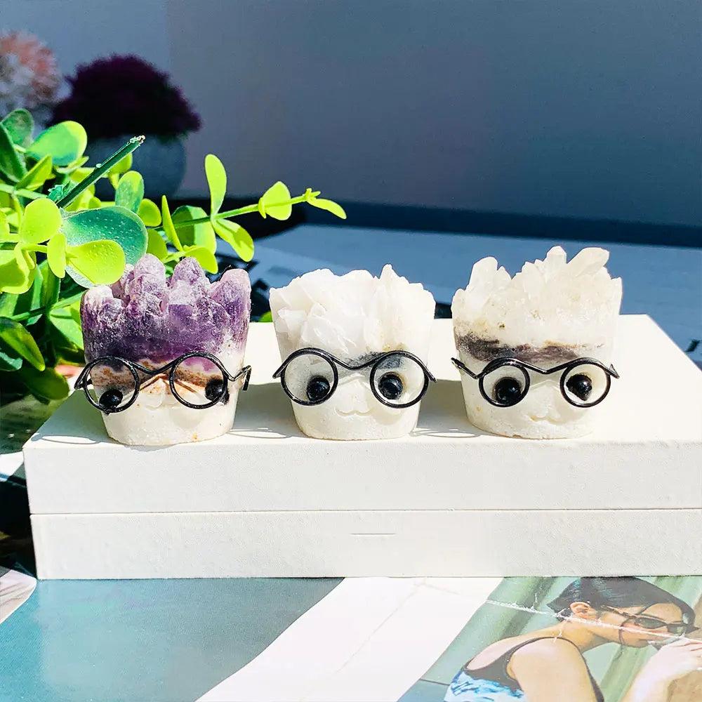 Natural amethyst and quartz crystal cluster ornaments featuring cute faces with glasses, perfect for desk decor.