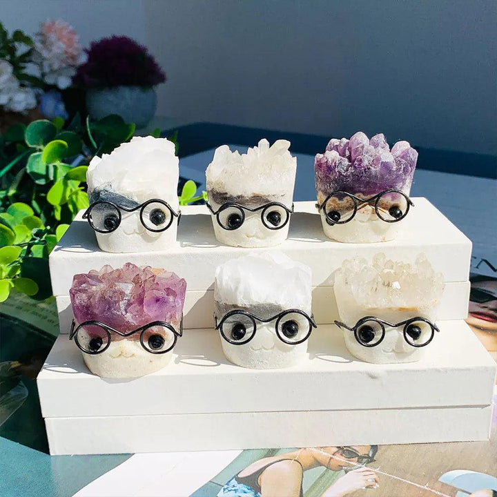 Natural Amethyst and quartz crystal cluster ornaments featuring cute faces with wire glasses for a charming desk decor.