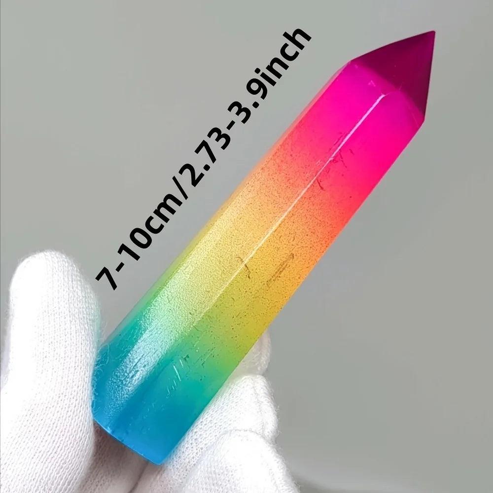 Vibrant rainbow aura selenite pillar crystal, a healing stone with iridescent metallic colors.