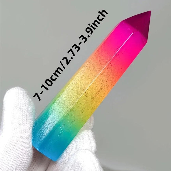 Vibrant rainbow aura selenite pillar crystal, a healing stone with iridescent metallic colors.