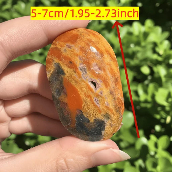 Polished Blue Apatite with Sunstone crystal palm stone showing vibrant orange and blue healing energy.