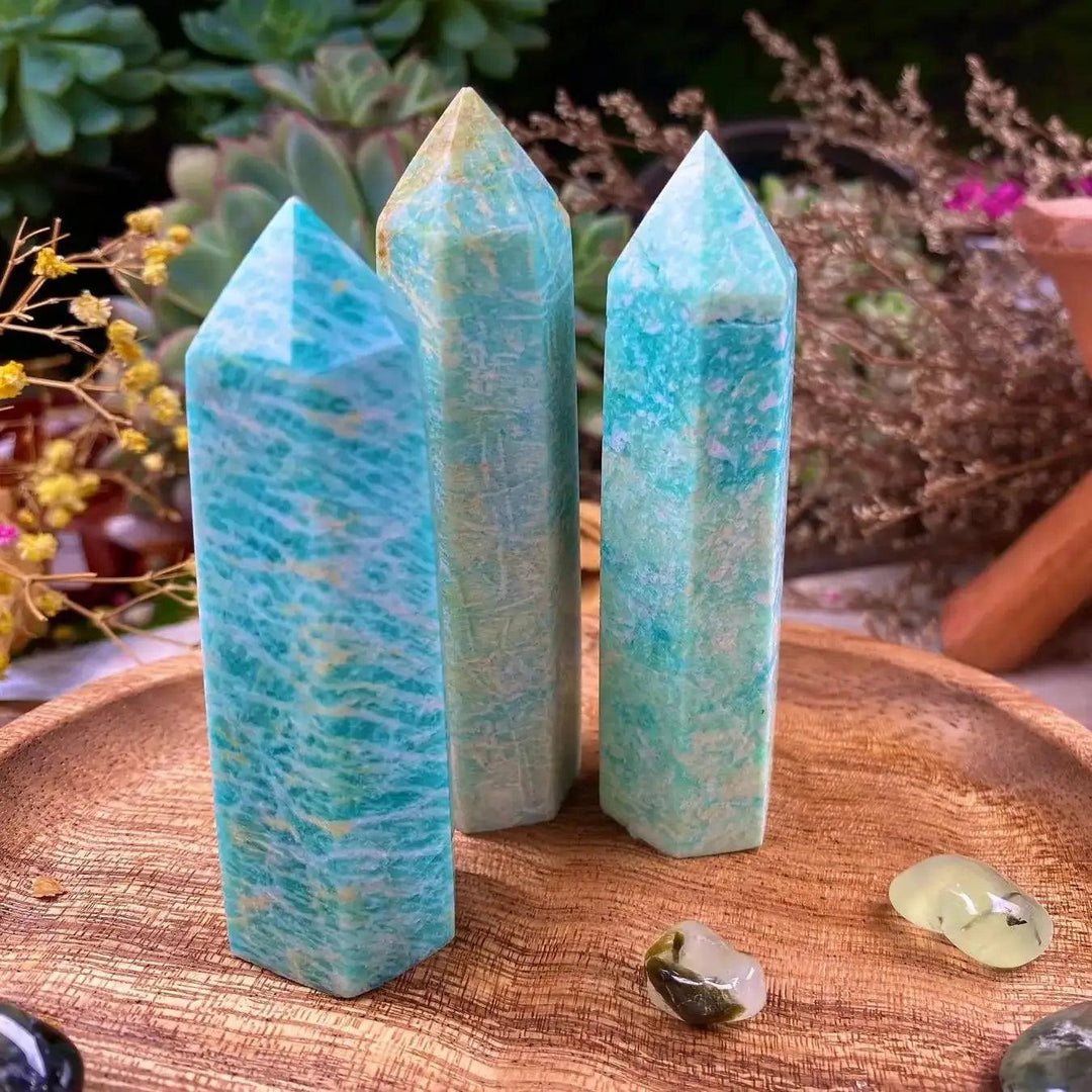 Three turquoise Amazonite crystal towers on a wooden tray, perfect for healing and aesthetic home decor.