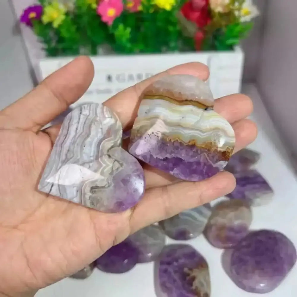 Polished amethyst agate heart sculpture with beautiful purple banding, perfect for romantic decor and healing energy.