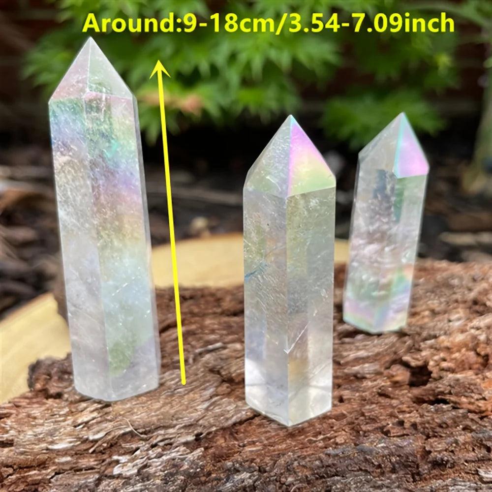 Iridescent electroplated clear quartz crystal towers with healing aura energy on a rustic wood base.