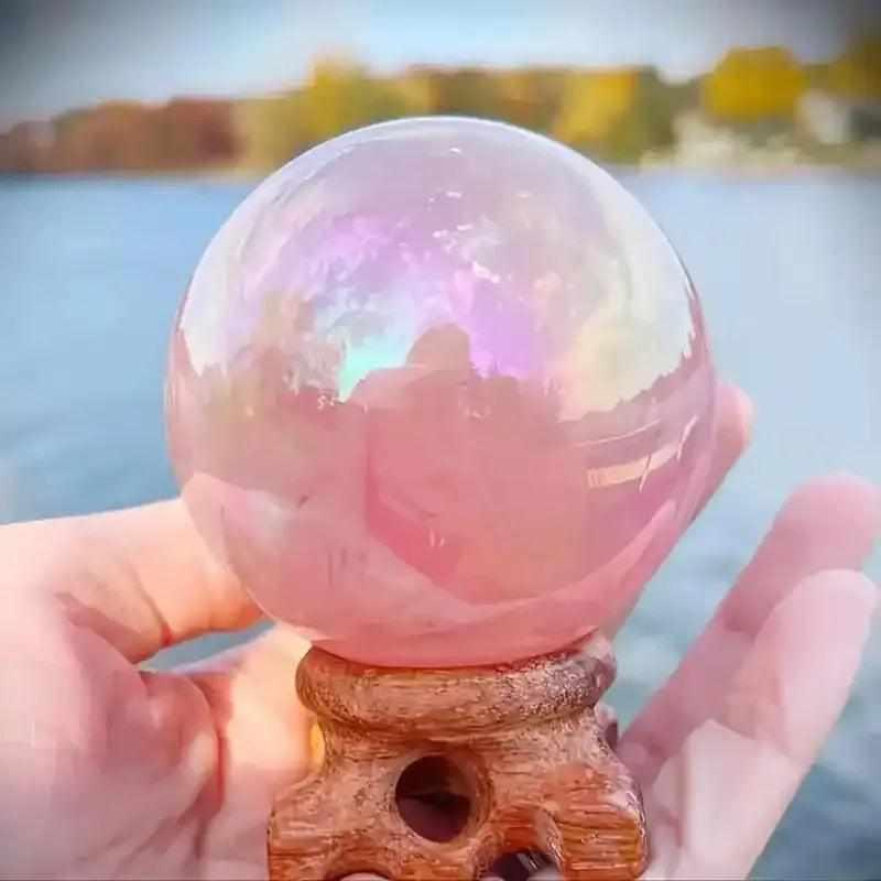 Gorgeous electroplated pink rose quartz sphere with an iridescent finish, perfect for love and healing energy.