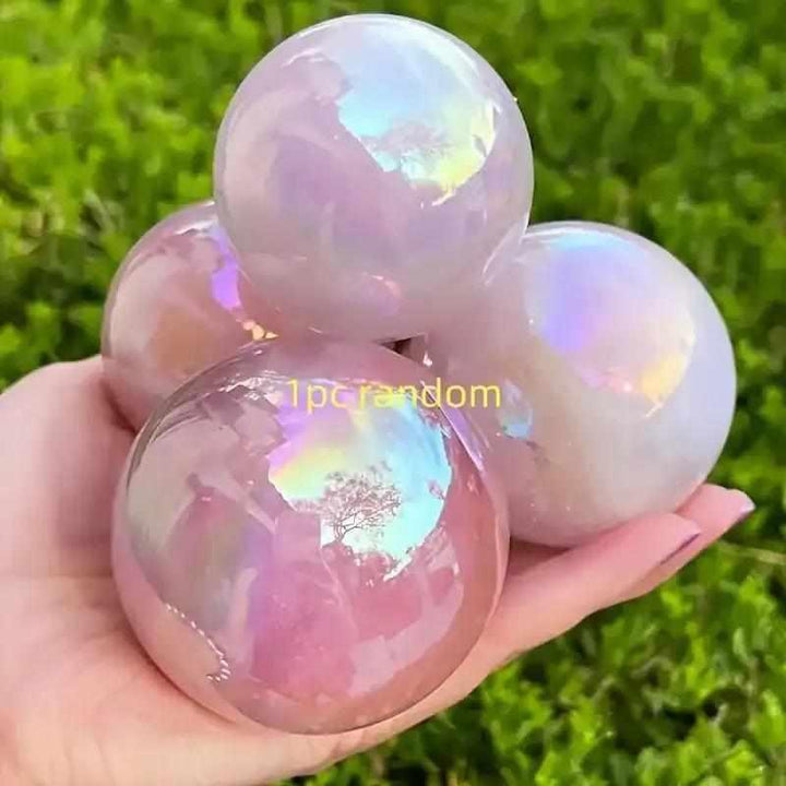 Gorgeous electroplated pink rose quartz sphere with an iridescent finish, perfect for healing and unique crystal gifting.