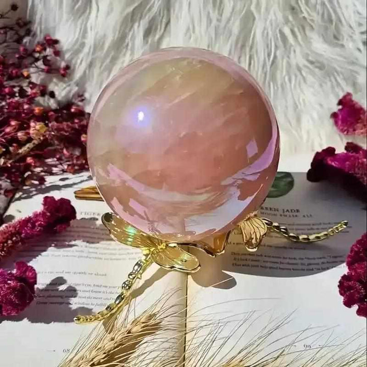 Gorgeous electroplated pink rose quartz sphere on a gold dragonfly stand, perfect for love, healing, and unique gifting.