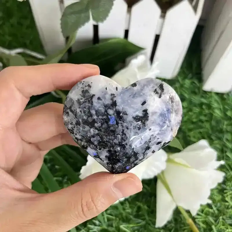 Polished black moonstone heart carving, a natural crystal gemstone perfect for reiki healing and elegant home decor.