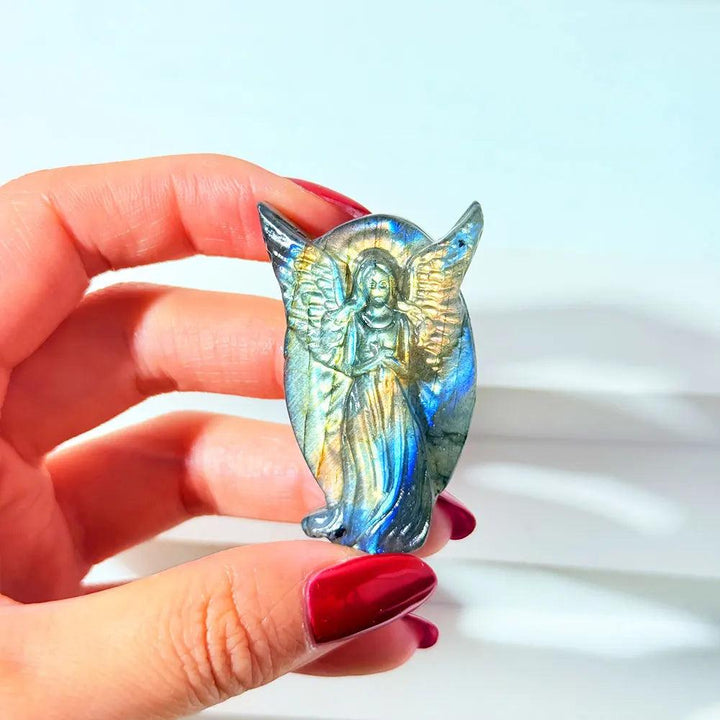 Hand-carved Labradorite angel figurine with iridescent blue and gold flash for healing home decor and spiritual energy.