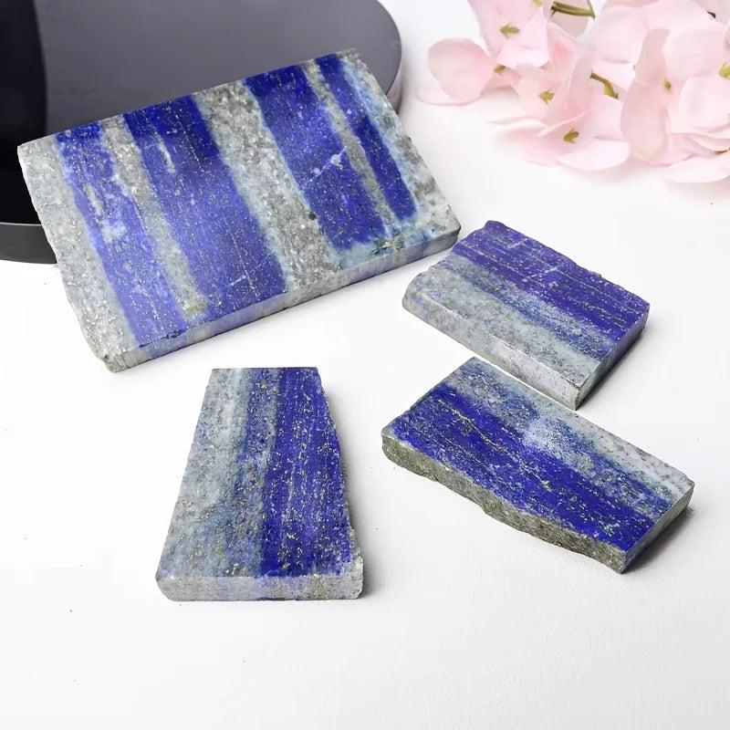Polished royal blue Lapis Lazuli slabs with golden pyrite flecks for healing and elegant decor.