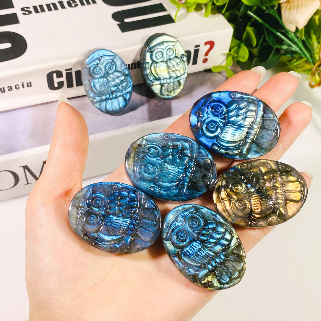Handcrafted natural Labradorite owl carvings featuring vibrant purple and blue flash for unique bohemian crystal decor.