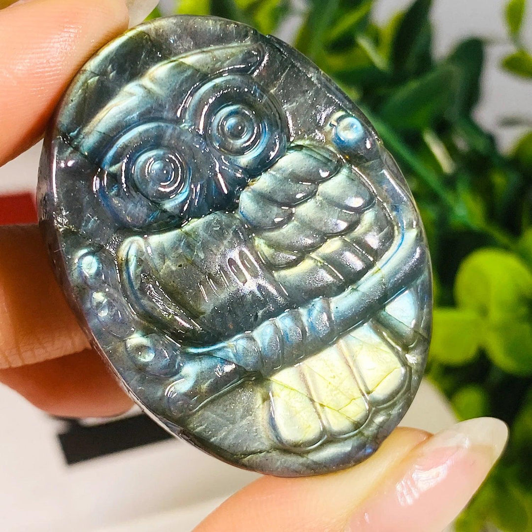 Handcrafted natural Labradorite owl carving featuring vibrant purple radiance and unique bohemian crystal energy.