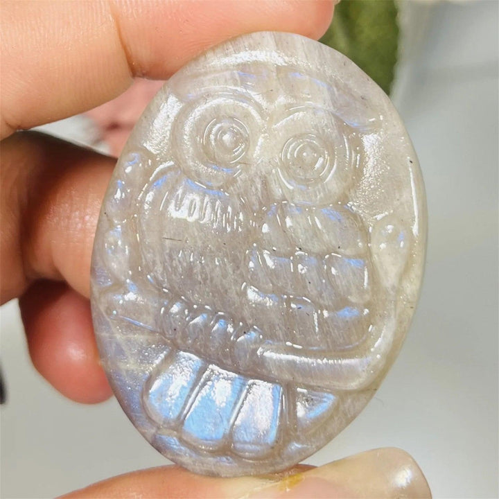 Handcrafted natural labradorite owl carving featuring a mystical purple flash and unique bohemian crystal energy.