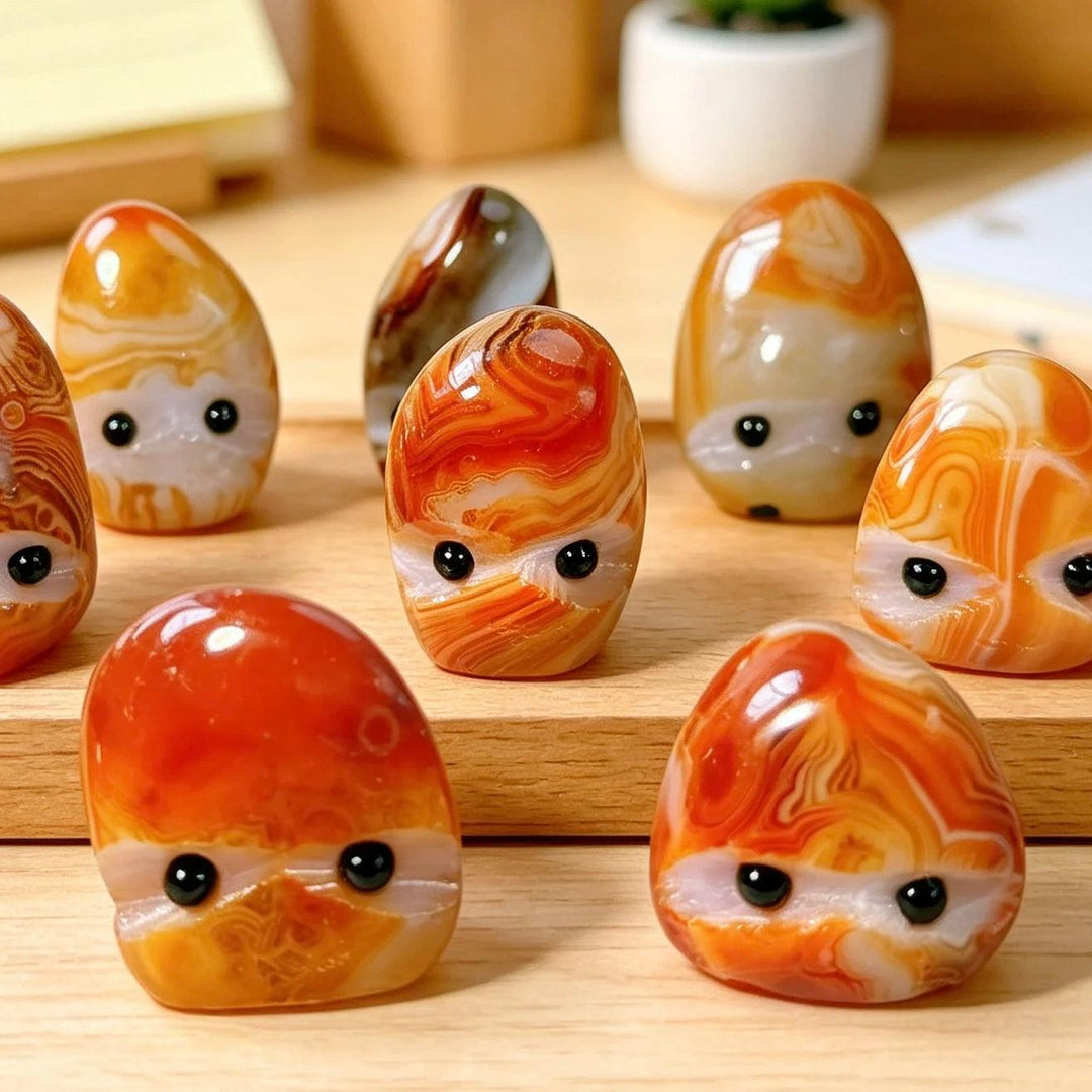Hand-polished natural sardonyx crystal hedgehog pocket stones with vibrant orange swirls for healing and home decor.