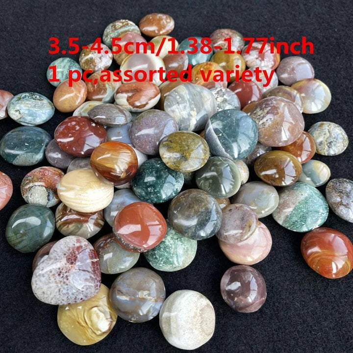 Assorted colorful Ocean Jasper palm stones, polished unrefined healing crystals for home decor.
