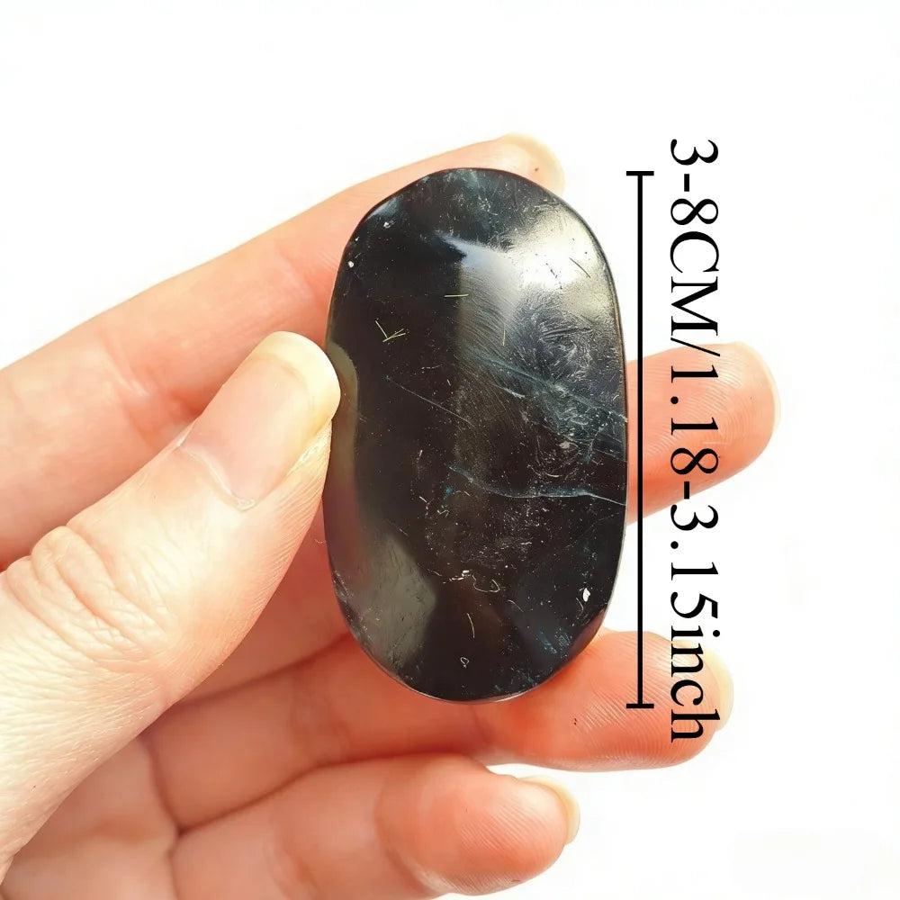 Polished black rose fluorite crystal palm stone for healing, measuring 3 to 8cm.