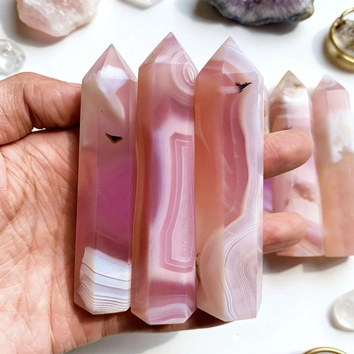 Polished pink agate pillar crystal points with natural banding for healing and bohemian home decor.