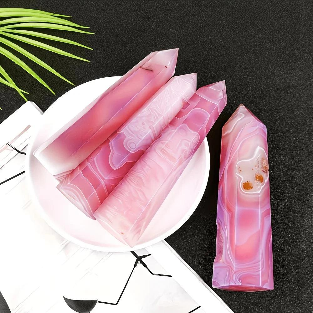 Polished pink agate pillar crystal point with natural banded patterns for healing and home decor.