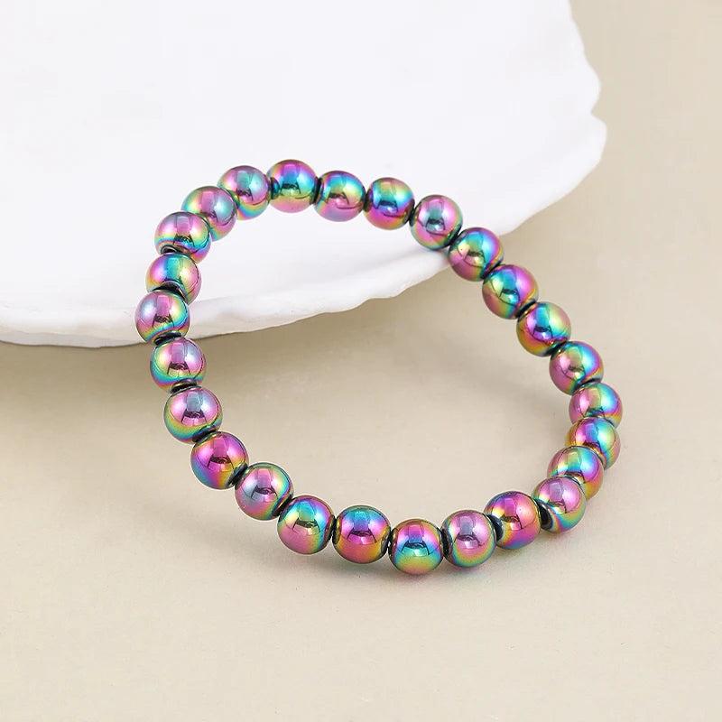 Vibrant 4 6 8 mm plated hematite stretch bracelet, featuring iridescent rainbow beads for a classic, stylish look.