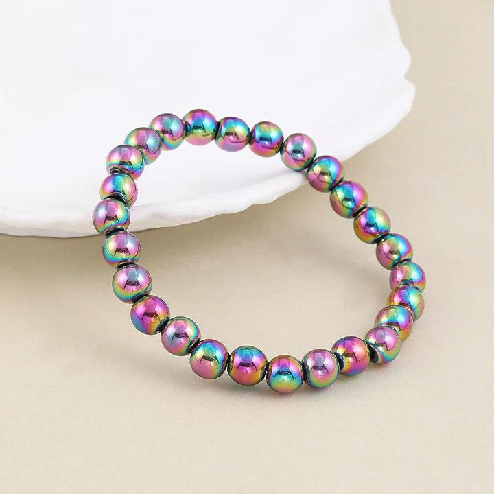 Vibrant 4 6 8 mm plated hematite stretch bracelet, featuring iridescent rainbow beads for a classic, stylish look.