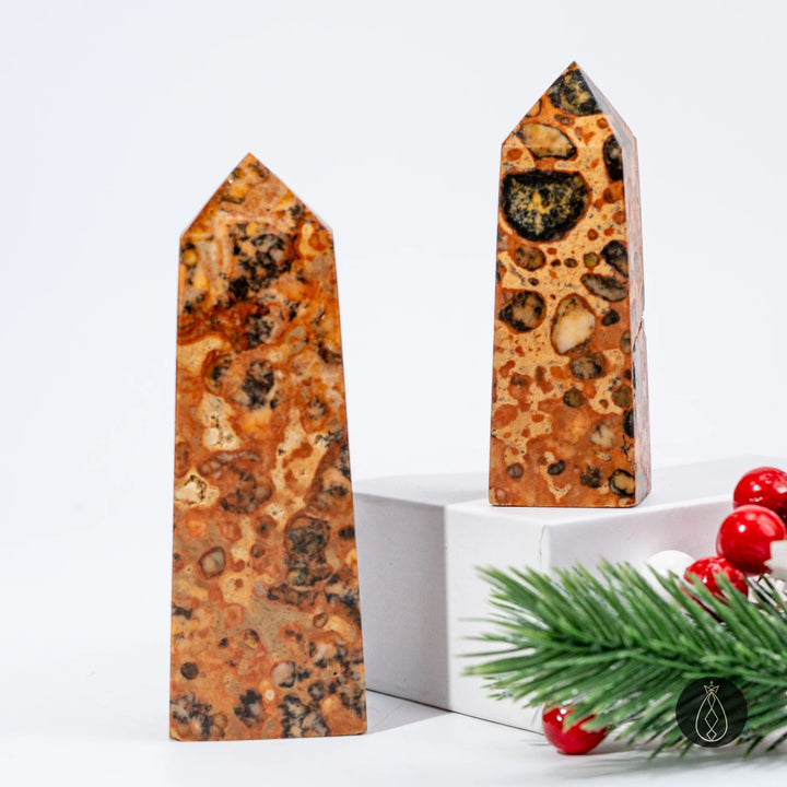 Hand-carved 6–8cm & 8–10cm Natural Dragon Palace Relic Tower crystal, a healing stone with unique brown and black patterns.