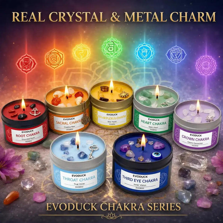 Seven 85g chakra soy candles in colorful tins with crystal accents, metal charms, and symbolic lids for intention setting.
