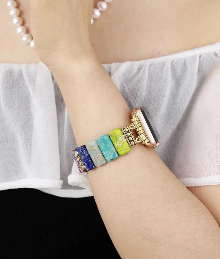 Crystal Destiny 7 Chakra Imperial Jasper Apple iWatch band with colorful rectangular beads on a wrist.