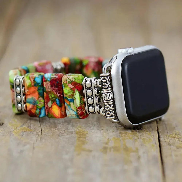 Crystal Destiny's 7 Chakra Imperial Jasper Apple iWatch band with colorful rectangular beads and ornate silver connectors.