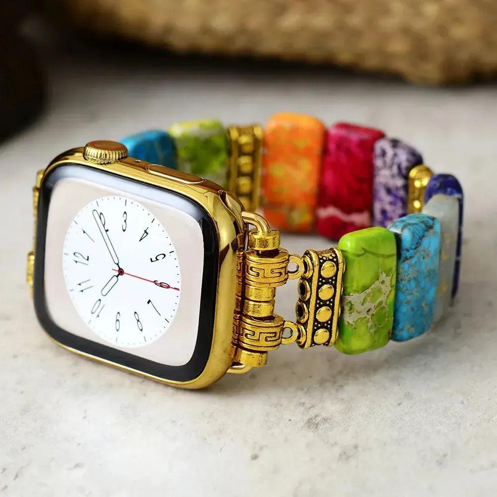 Crystal Destiny's 7 Chakra Imperial Jasper Apple iWatch band with vibrant, rectangular stone beads and gold connectors.
