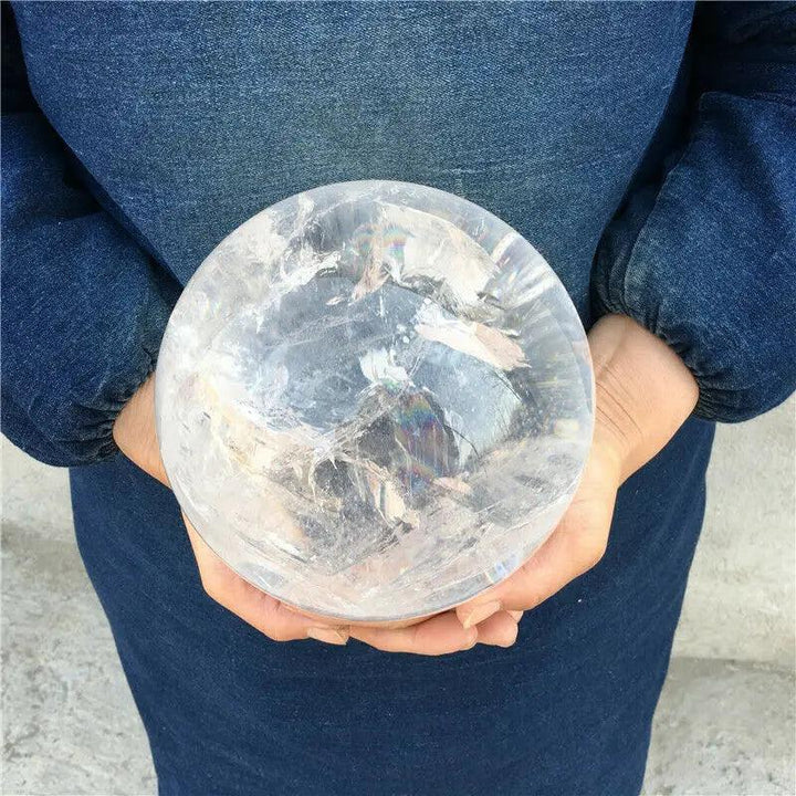 Large AAAA natural transparent white quartz crystal ball with internal rainbows, perfect for home decor and healing.