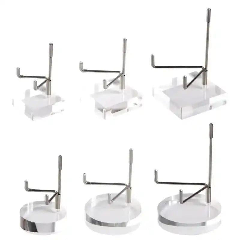 Six clear acrylic display stands with silver metal arms, showcasing various sizes and round or square bases for crystals.