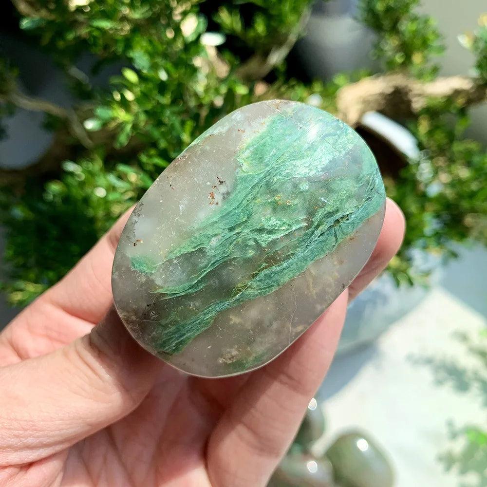 Polished African Jade Crystal Palm Stone with green and grey swirls for grounding heart chakra energy.