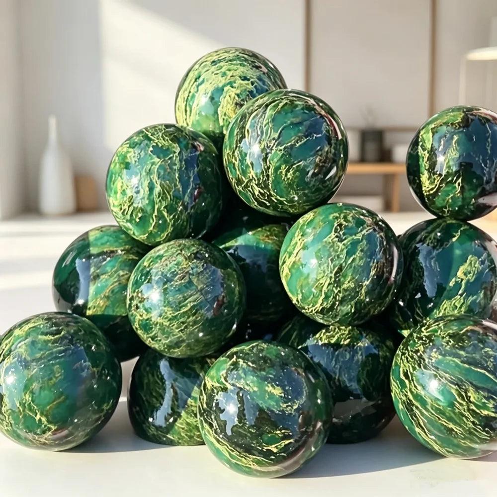 Polished African Verdite sphere, a deep green grounding crystal for heart and root chakra healing, 50-60mm in size.