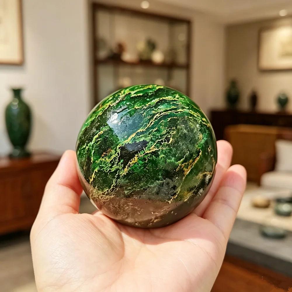 Polished 50-60mm African Verdite sphere in deep green, a grounding crystal for heart chakra healing and abundance.