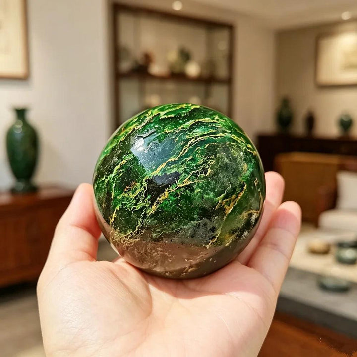 Polished 50-60mm African Verdite sphere in deep green, a grounding crystal for heart chakra healing and abundance.