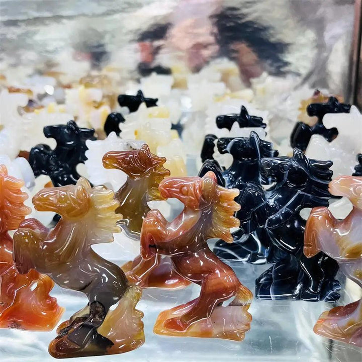 Hand-carved polished agate horse sculpture with natural banding, offering grounding energy in earthy, translucent tones.