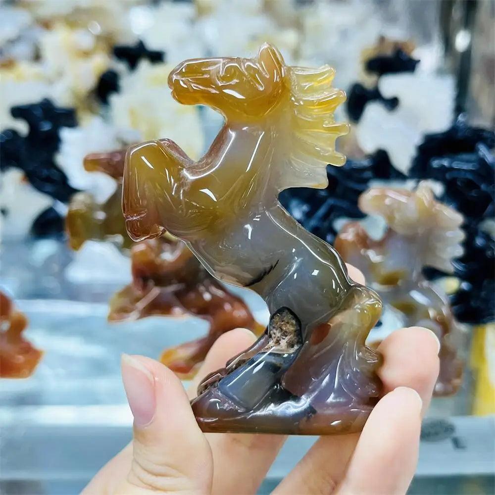 Hand-carved agate horse sculpture with polished, earthy banded layers for grounding energy and steady, natural beauty.