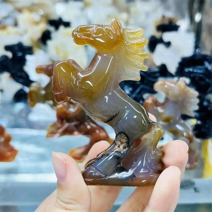 Hand-carved agate horse sculpture with polished, earthy banded layers for grounding energy and steady, natural beauty.