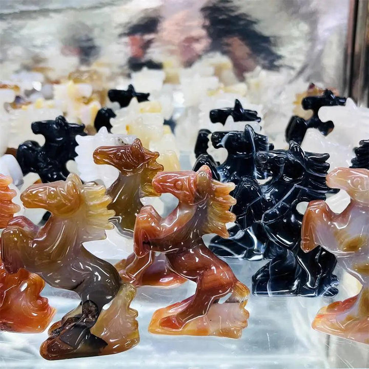 Hand-carved agate horse sculpture with polished, banded stone in earthy tones for grounding energy and steady balance.