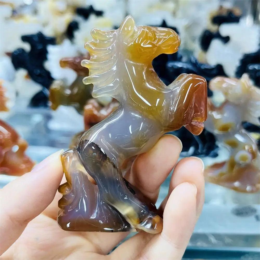 Hand-carved agate horse sculpture with translucent, banded earthy tones for grounding energy and balanced decor.