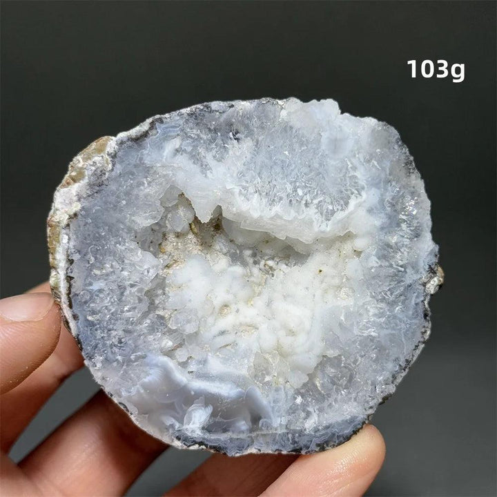 Natural Agate crystal cave egg, 103g, with a sparkling white druzy interior and banded gray exterior.