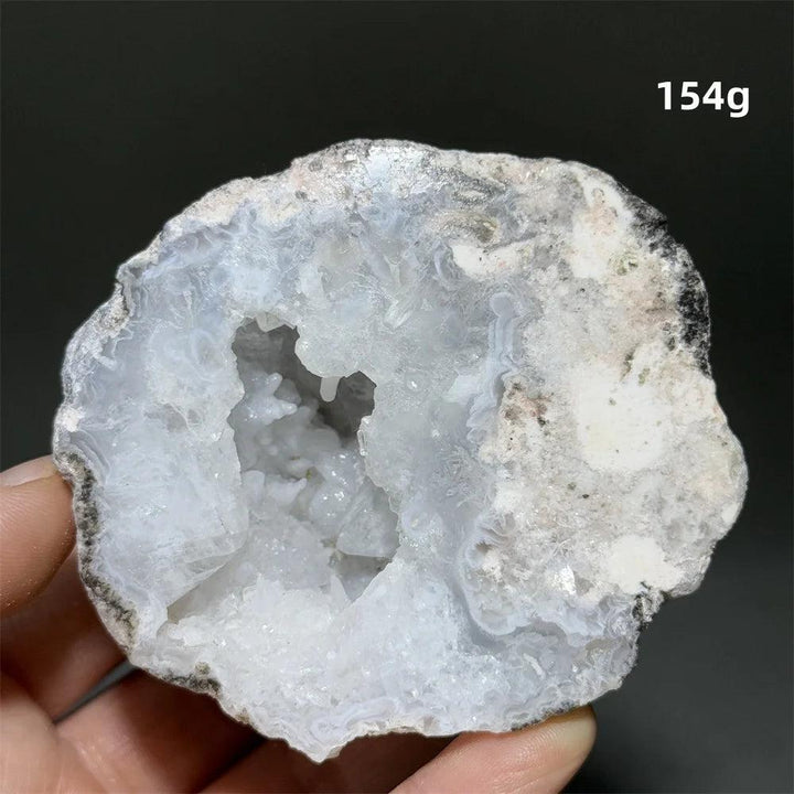 Natural Agate crystal cave egg with a sparkling white druzy interior, grounding and calming.